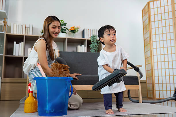 istock Child Engaging in Household Cleaning with Parent 2226245875