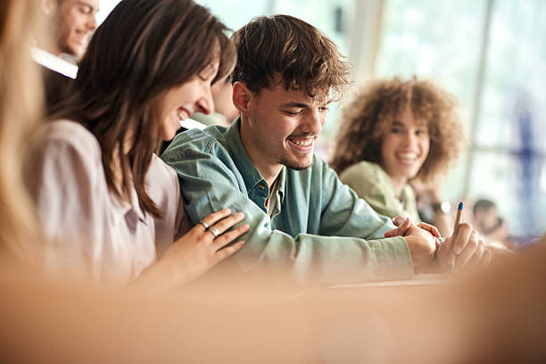 istock Happy college couple having a class at lecture hall. 2226245910