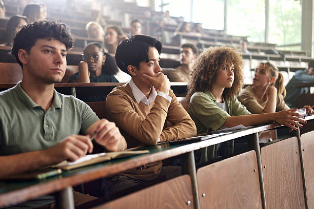 istock Pensive Japanese student on a class at lecture hall. 2226247014