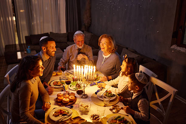 istock Happy multi-generation family talking during dinner on Hanukkah. 2226247270