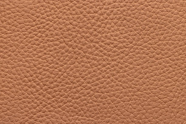 Genuine leather, brown color. Background or texture sample.