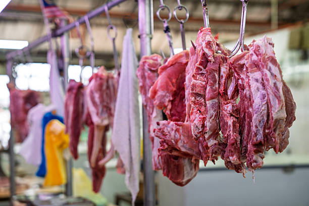 istock Raw Meat Hanging at Butcher Stall 2226253106