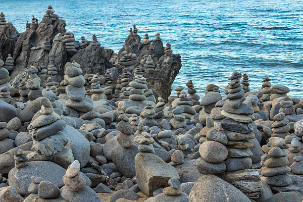 istock Captain Cook Highway Rock Stacks. Balanced rock stacks line the shoreline in Far North Queensland, Australia. Carefully placed stone formations , set against a backdrop of the Coral Sea. 2226254096