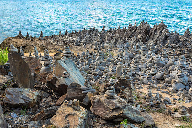 istock Captain Cook Highway Rock Stacks. Balanced rock stacks line the shoreline in Far North Queensland, Australia. Carefully placed stone formations , set against a backdrop of the Coral Sea. 2226254251