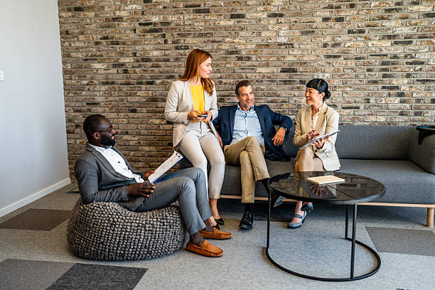 istock Business people having informal meeting in modern office 2226256033