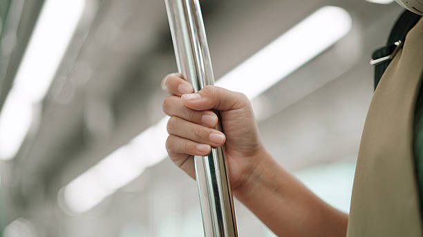 istock Asian woman holding handrail while commuting by sky train 2226256960