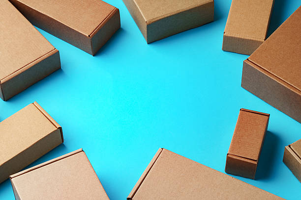 istock A collection of cardboard boxes arranged on a bright blue surface 2226261222