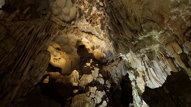 istock Spectacular limestone formations and stalactites inside a cave in Ha Long Bay, Vietnam. 2226262414