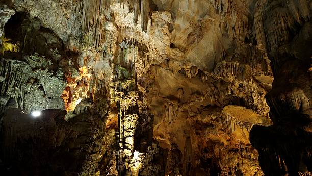 istock Spectacular limestone formations and stalactites inside a cave in Ha Long Bay, Vietnam. 2226262417