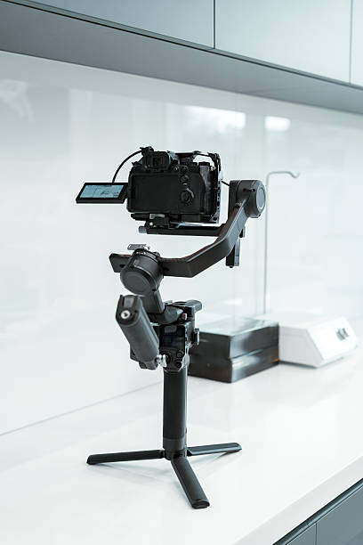 istock A camera gimbal stabilizer placed on a white countertop in a modern kitchen 2226262758