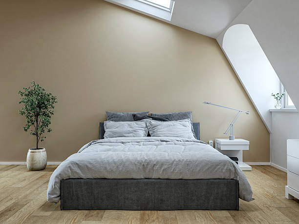 istock Front view of a modern minimalist attic bedroom with a bed, windows and decoration 2226263277