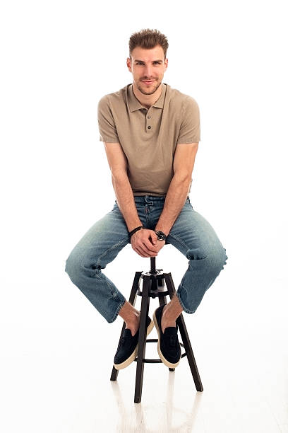 istock Studio shot of a handsome young man sitting against isolated white background 2226266479