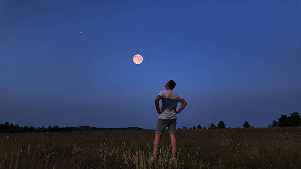 istock Amateur astronomer watching stars, Moon, planets and other celestial objects from a field in nature. 2226268648
