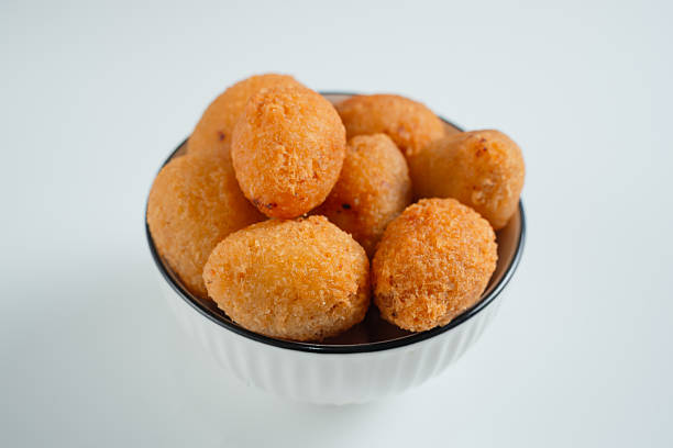 istock Combro is a typical Sundanese fried food. Combro is made from grated cassava which is shaped round or oval and filled with oncom and chili sauce and then fried. 2226270986