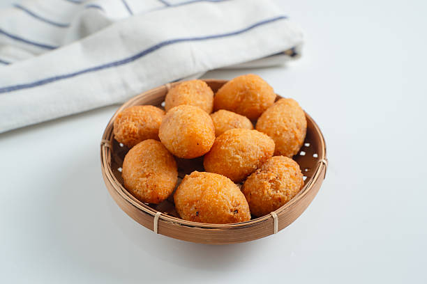 istock Combro is a typical Sundanese fried food. Combro is made from grated cassava which is shaped round or oval and filled with oncom and chili sauce and then fried. 2226270988