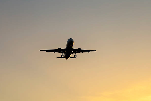istock Plane flying with clearly sky at sunset 2226273412