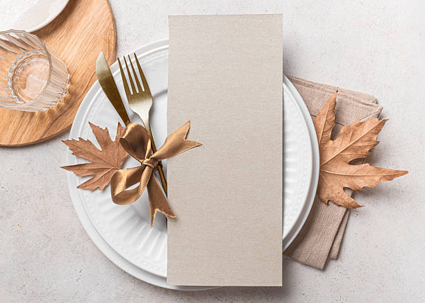 istock Blank 4x9 menu card  on table setting with autumn leaves 2226274832