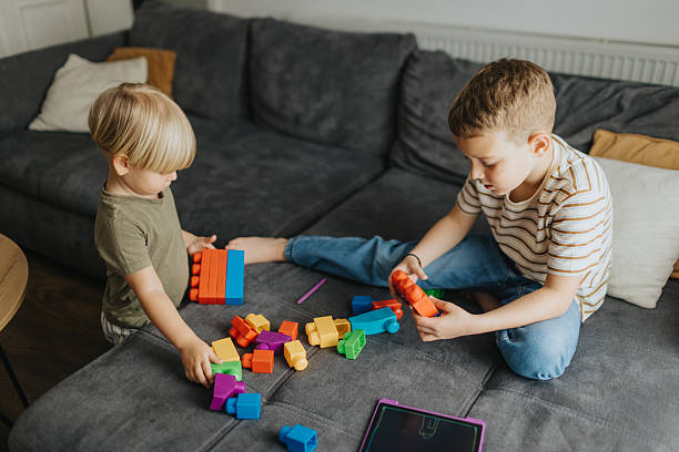 istock Cute brothers playing together at home 2226275039