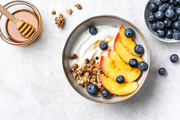 istock Granola bowl with greek yogurt, peach and blueberries 2226275929