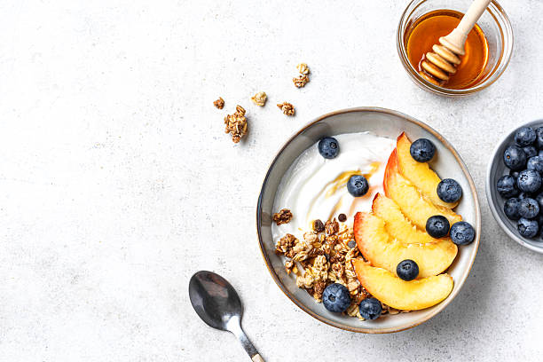 istock Granola bowl with yogurt, peach, blueberries and honey 2226276028