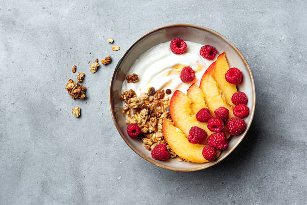 istock Granola bowl with yogurt, peach, raspberry and honey 2226276278