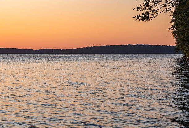 istock Sunset over the lake, the sun's rays reflecting in the water like a path. 2226282782
