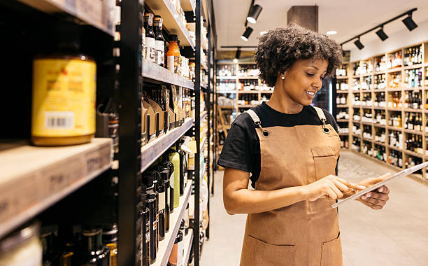 istock Supermarket employee using digital tablet taking inventory of products 2226283145