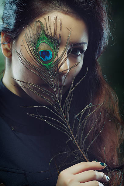 istock Beauty with a peacock feather 2226284181