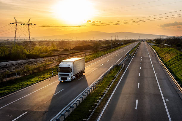 istock White truck on a highway 2226285645