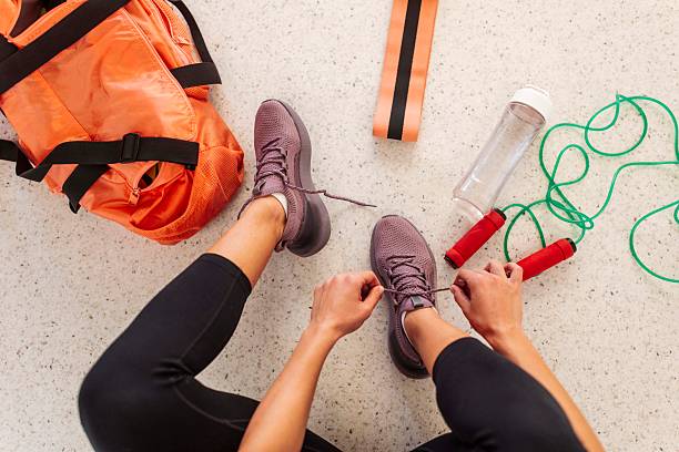 Muscular Sportswoman Preparing for Workout Routine