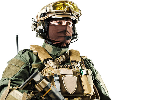 istock A heavily armed soldier in specialized tactical equipment looking forward, isolated on a white background for military or security-related themes 2226286825