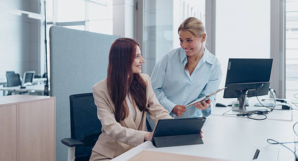 istock Professional Colleagues Actively Collaborating in a Modern Office Setting for Growth and Success 2226287129