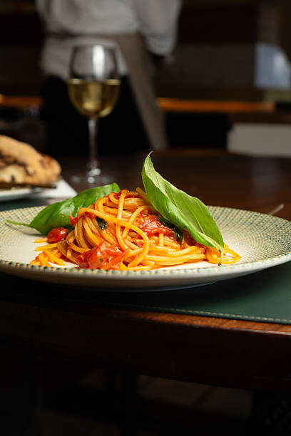 istock Spaghetti with fresh tomato and basil on a plate at a restaurant 2226287253