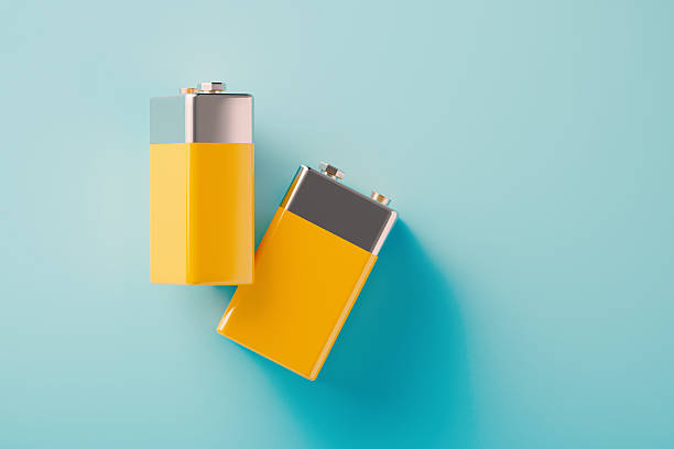 istock Yellow Disposable Batteries On Blue Background 2226288497
