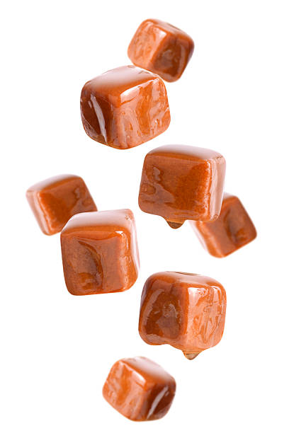 istock Salted caramel cubes levitation isolated on transparent background. 2226292438