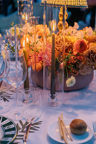 istock Aesthetic table setting for a dinner, candles, table lamp and flowers, warm cozy light 2226293266