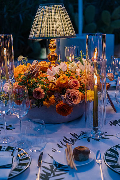 istock Aesthetic table setting for a dinner, candles, table lamp and flowers, warm cozy light 2226293331