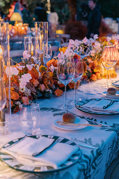 istock Aesthetic table setting for a dinner, candles, table lamp and flowers, warm cozy light 2226293341