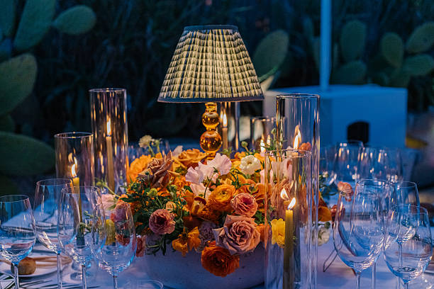istock Aesthetic table setting for a dinner, candles, table lamp and flowers, warm cozy light 2226293349