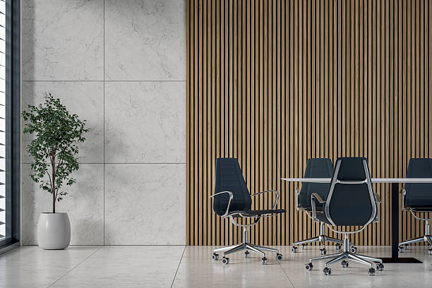 istock A modern office interior with conference table, chairs on marble tiled floor, window and decoration in front of half marble half hardwood slats 2226293792