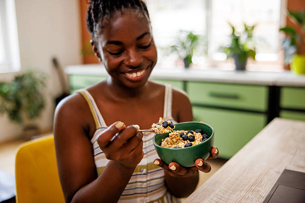 istock Smiling Lady Enjoys Healthy Breakfast in Home Office 2226296245