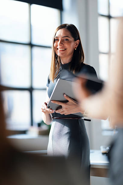 Confident Businesswoman Smiling in a Bright Modern Office Environment