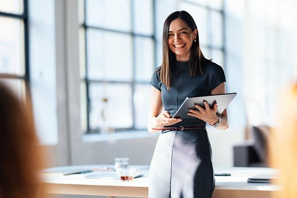 istock Confident Businesswoman Leading a Presentation in a Modern Office Setting 2226298665