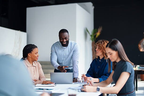 istock Team Collaborating During Business Meeting in Modern Office Setting 2226298682