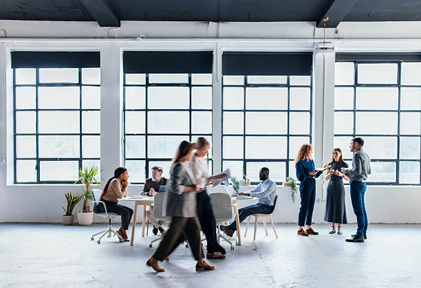 Group of Professionals Collaborating in a Modern Open Office Workspace