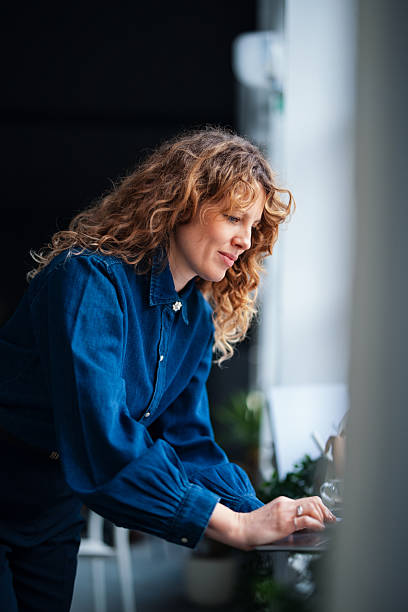 istock Confident Professional Woman Working on a Laptop in a Modern Office 2226298698