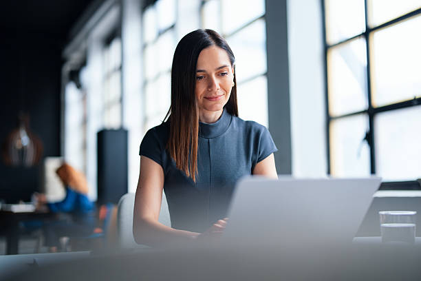 istock Focused Business Professional Working on Laptop in Modern Office Setting 2226298776