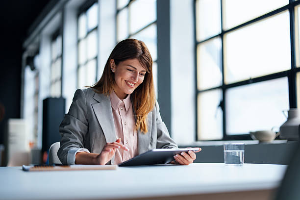 istock Business Professional Working on Digital Tablet in a Modern Office Setting 2226298867