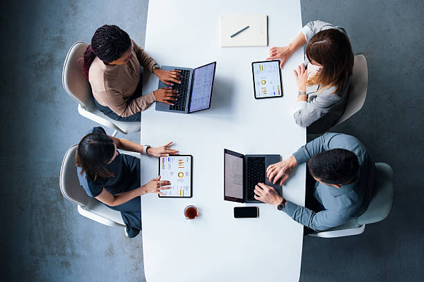 istock Top-View of Professionals Collaborating in a Modern Office Meeting 2226298874