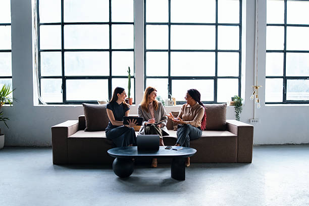 istock Professional Team Conversation in Open Office Lounge with Natural Light 2226298878